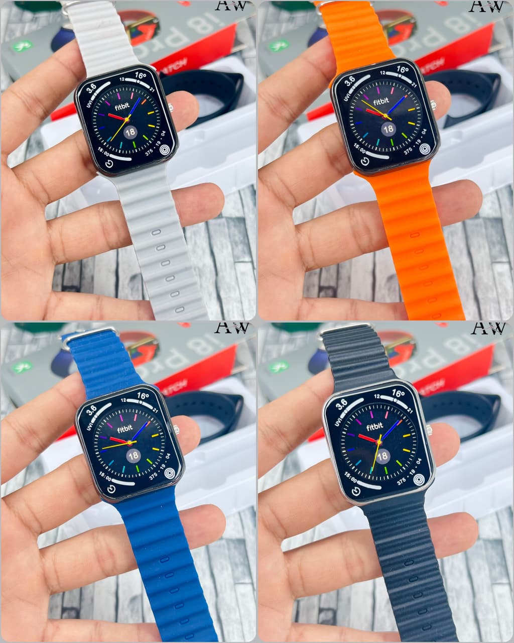 Smartwatch with different colored bands held by a hand against a blurred background.