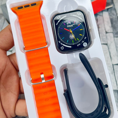 Smartwatch with orange band and cable in packaging on a tiled floor background