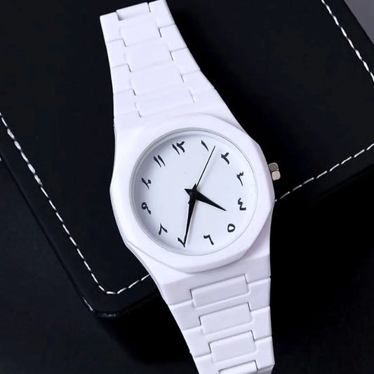 White wristwatch with a black face on a dark background