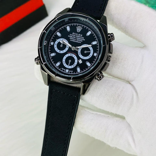 Black wristwatch with detailed face on a white background