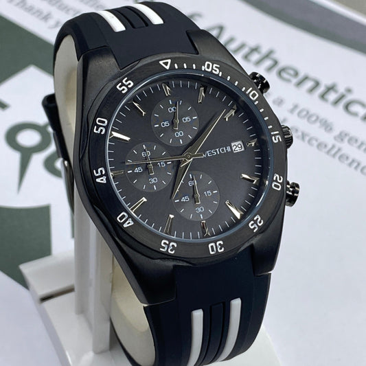 Black wristwatch with detailed face on a white stand, with a certificate of authenticity in the background.